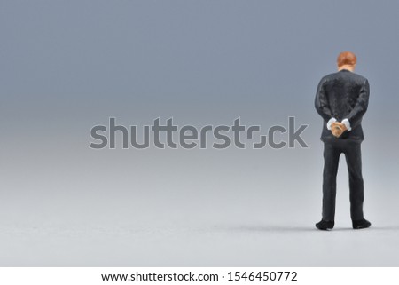 Miniature people business man is standing