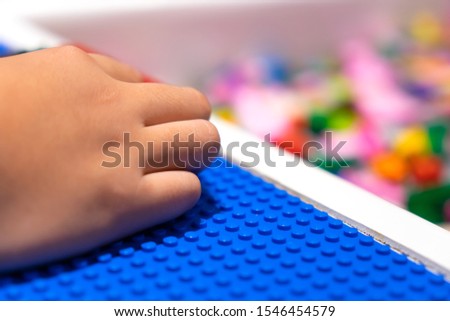 Hand kid playing brick toy for relax