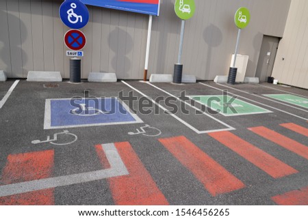 Handicapped parking car only electric vehicle ve pictogram on street