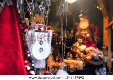 The Outdoor Christmas Market Counter with festive decorations and toys. Background image with 
toy snowman. 