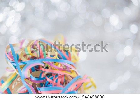 Streamers background. Simple beautiful shining background.
Wooden table with paper streamers for the funny party.