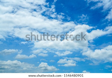 Beautiful blue sky and white cumulus clouds abstract background. Cloudscape background. Blue sky and fluffy white clouds on sunny day. Nature weather. Bright day sky for happy day background. 