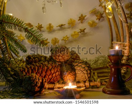picture with a decorated basket and cones, candles, suitable for Christmas
