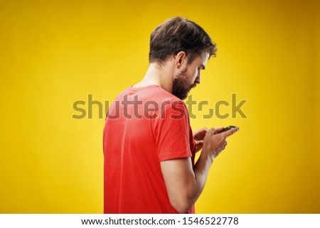 Handsome bearded man in the phone online wi-fi 