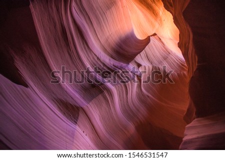 Beautiful view of amazing sandstone formations in famous Antelope Canyon on a sunny day with blue sky near the old town of Page at Lake Powell, American Southwest, Arizona, USA

