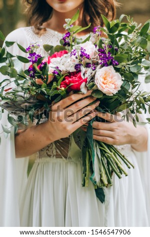 beautiful bouquet, bridal bouquet, flowers of the bride. The bride is waiting for the groom in the white room.