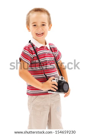 Happy little boy with photo camera
