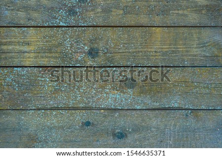 Wooden rustic pattern with blue paint on it