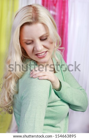 Woman with shoulder pain Royalty-Free Stock Photo #154663895