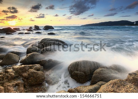 Sea landscape with waves on the beach against sunset at Phuket,Thailand