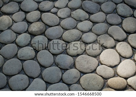 Natural stones on the bottom of dry ponds floor