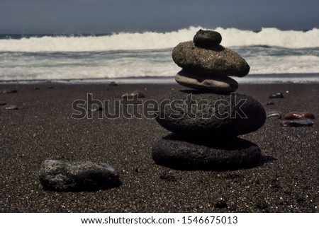 Rocks stacked on the beach in Bali