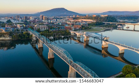 Aerial view of a bend in the Tennessee River flowing around beautiful Chatanooga TN Royalty-Free Stock Photo #1546683047
