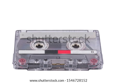 Old cassette tape on white background with shadows