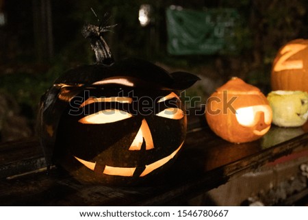 Spooky Halloween pumpkins, Jack O Lantern, old witch with hat, with burning candles
