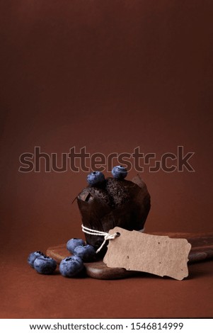 chocolate muffin with blueberry and craft tag