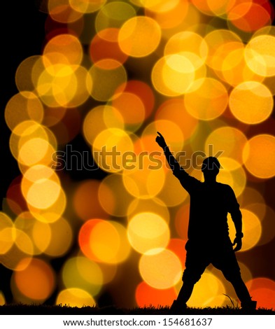 christmas lights with a silhouette of a man