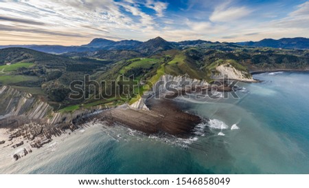 Zumaia flysch geological strata in Sakoneta beach, Basque Country Royalty-Free Stock Photo #1546858049