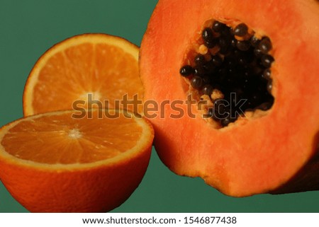 A picture composed of tasty fruits like papaya and oranges.