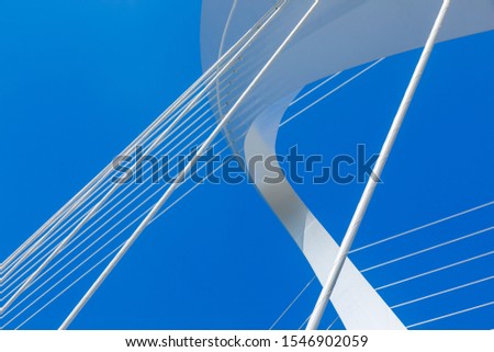 Close up of the structural lines of the bridge under the blue sky