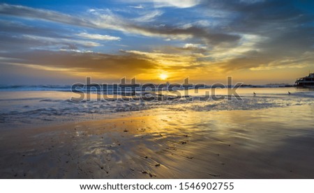 beach sunrise dramatic sky reflections sandy Currumbin gold coast seagulls dramatic morning