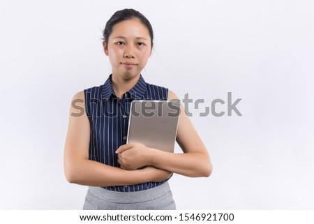 A beautiful woman portrait: Business asia woman is using new technology and finding some information for her work. Charming businesswoman feels happy and enjoy her work. Gorgeous woman stand at office