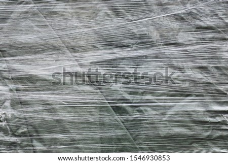 Tightly stretched plastic wrap texture around a pallet stack