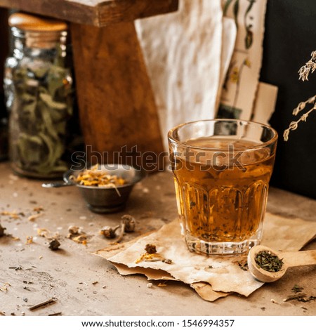 Herbal Tea in a Glass and Variety of Dried Herb Mixes, square