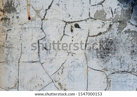 Stucco white wall background or texture.Wall fragment with scratches and cracks.White and golden messy wall stucco texture background. Decorative wall paint.Ultrawide Grunge Seamless Grey Grunge.