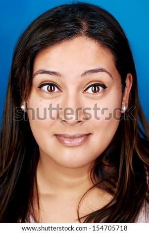 funny face portrait of woman on blue background