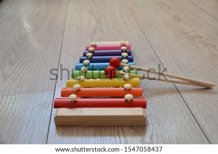Colorful xylophone for children on wooden background