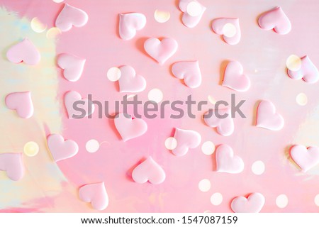 Beautiful silk pink hearts on a pink background. Holiday concept Valentine's Day. Flat lay.