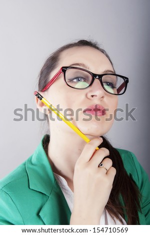 an image of attractive young businesswoman thinking