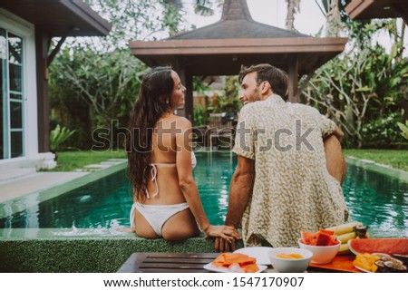 Happy couple spending time in a beautiful vacation house