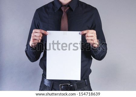 an image of young handsome businessman with blank card