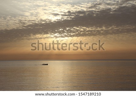 a beautiful dawn at sea ,the ship is sailing away,the ships on the sea at dawn,the ships on the sea at sunset,selective focus

