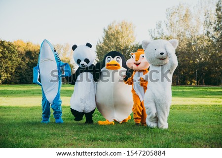 Group of mascots doing party. Concept about carnival, animals rights and lifestyle Royalty-Free Stock Photo #1547205884