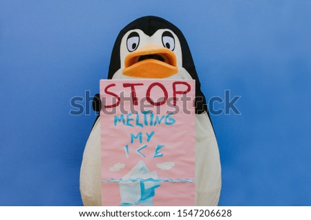 Penguin character has a message for humanity about global warming and ice melting