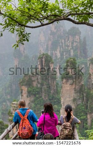 Tourists in Tianzi Avatar mountains nature park - Wulingyuan China - travel background