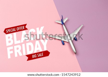 top view photo of toy airplane over color  background . Black friday sale- Image 