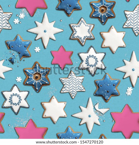 Seamless festive pattern with blue and pink cookie stars