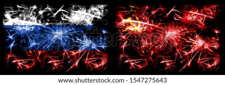 Russia, Russian vs USSR, Communist New Year celebration sparkling fireworks flags concept background. Combination of two states flags.
