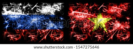 Russia, Russian vs Vietnam, Vietnamese New Year celebration sparkling fireworks flags concept background. Combination of two states flags.
