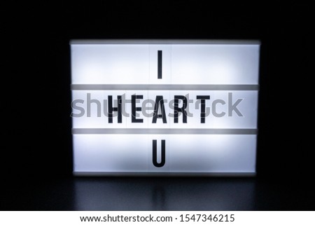 Text in english on lightbox sign spelling I Heart U.