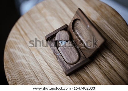 Handmade wooden flash drive in a box made of solid wood.