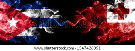 Cuba, Cuban vs Tonga, Tongan smoky mystic flags placed side by side. Thick colored silky travel abstract smokes banners 