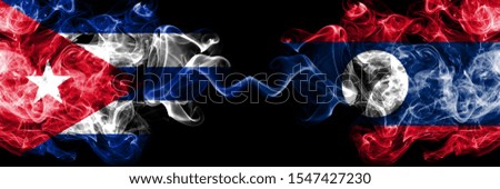 Cuba, Cuban vs Laos smoky mystic flags placed side by side. Thick colored silky travel abstract smokes banners 