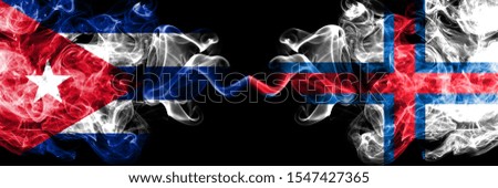 Cuba, Cuban vs Faroe Islands smoky mystic flags placed side by side. Thick colored silky travel abstract smokes banners 