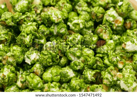Lush of Japanese matcha green tea popcorn for texture background, Popular snack with favorite movie