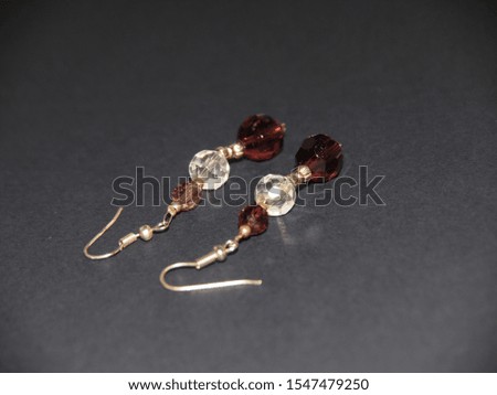 Luxury earrings isolated on a dark background